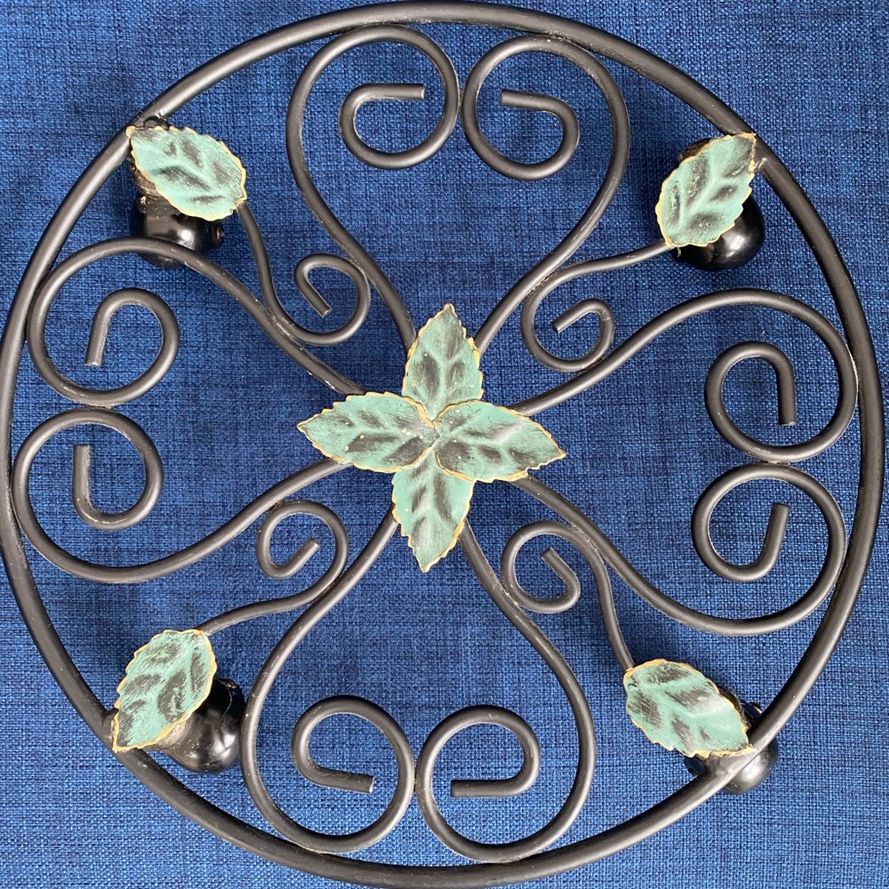Black metal rolling plant stand. 12 inch diameter